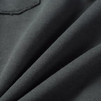 Charcoal gray knit fabric texture on sweatpants legs