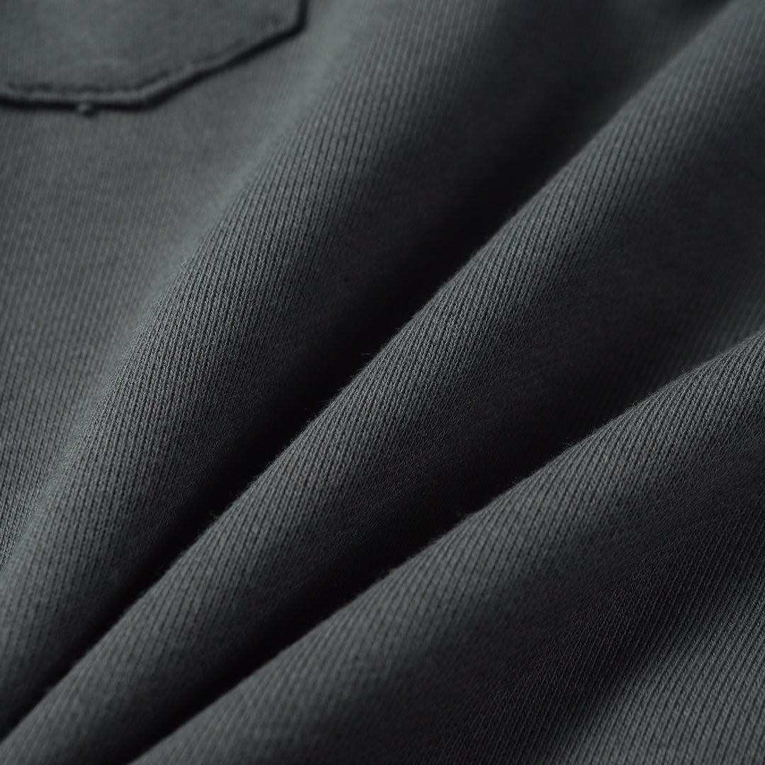 Charcoal gray knit fabric texture on sweatpants legs