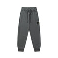 Charcoal gray jogger pants with elastic waistband, drawstring, and cuffed hems