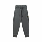Charcoal gray jogger pants with elastic waistband, drawstring, and cuffed hems