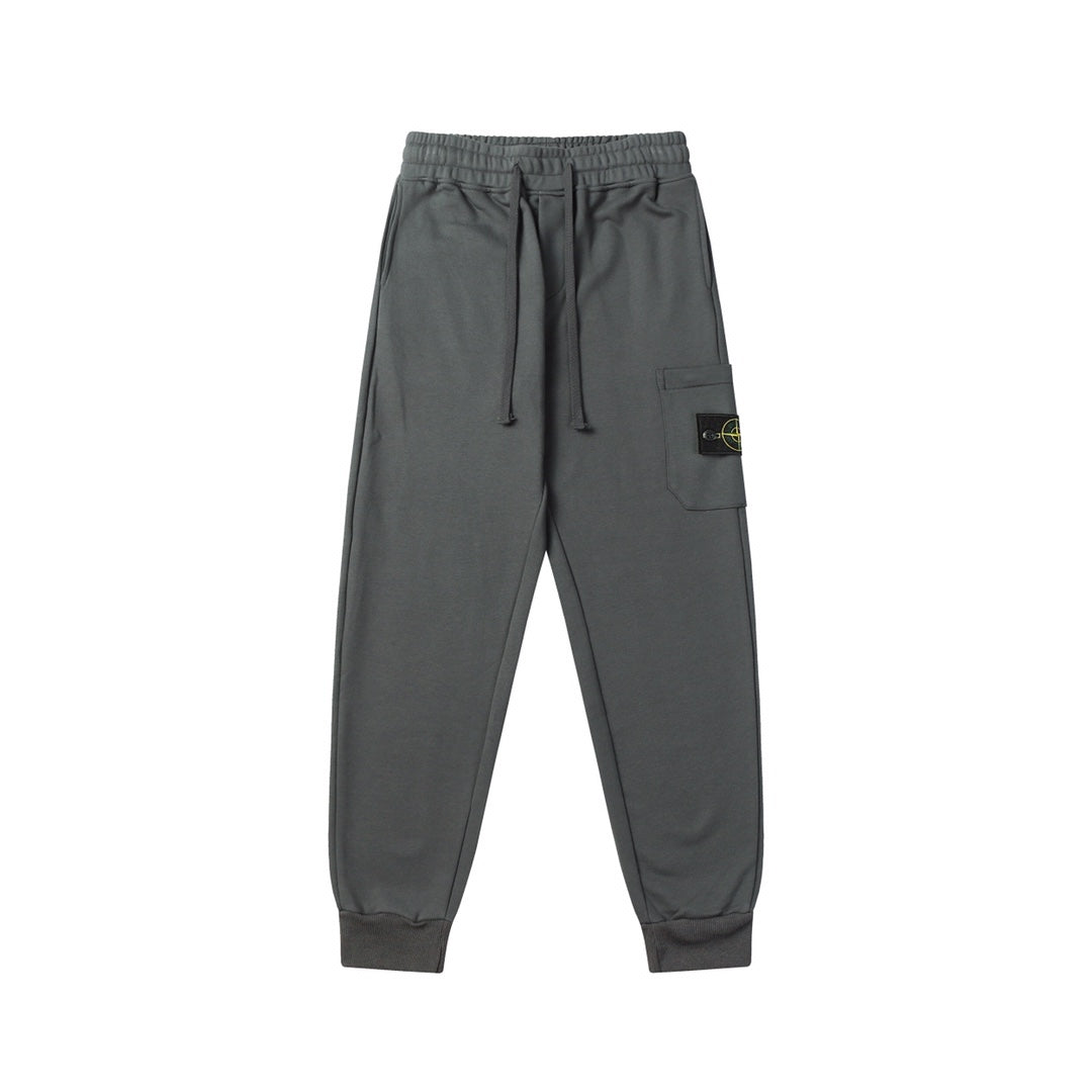 Charcoal gray jogger pants with elastic waistband, drawstring, and cuffed hems