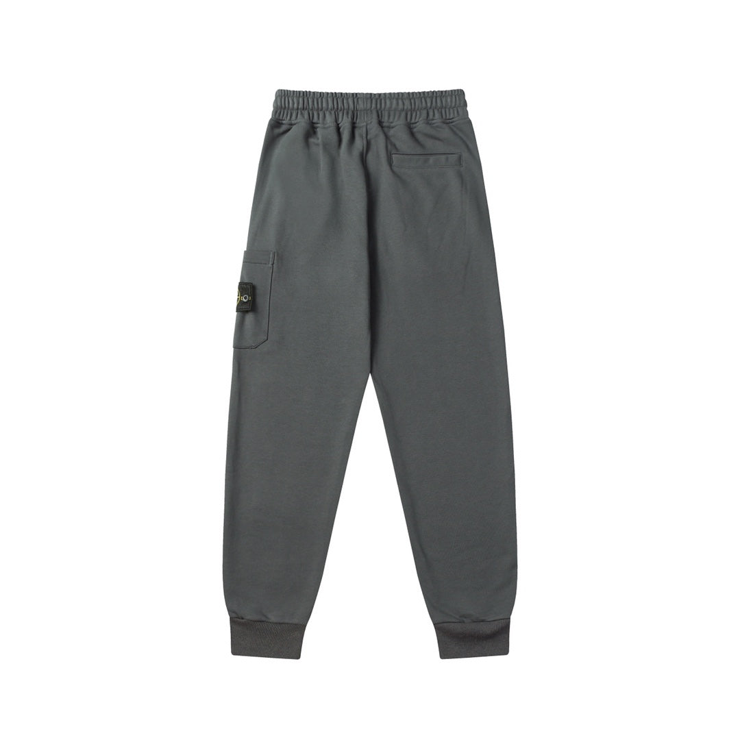 Charcoal gray track pants with side pocket and cargo patch on thigh, cuffed hem