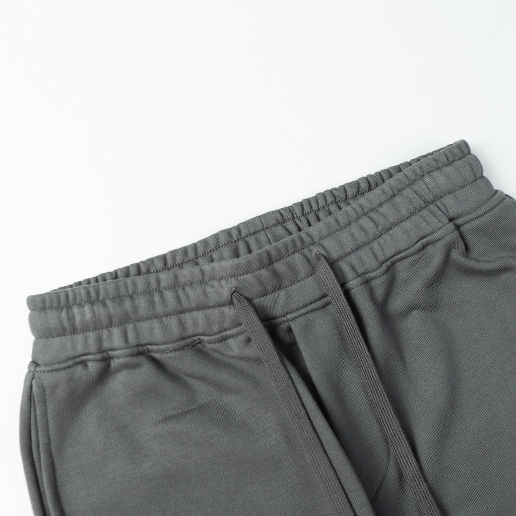 Charcoal gray sweatpants with elastic waistband, drawstring, and side seam pockets