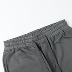 Charcoal gray sweatpants with elastic waistband, drawstring, and side seam pockets