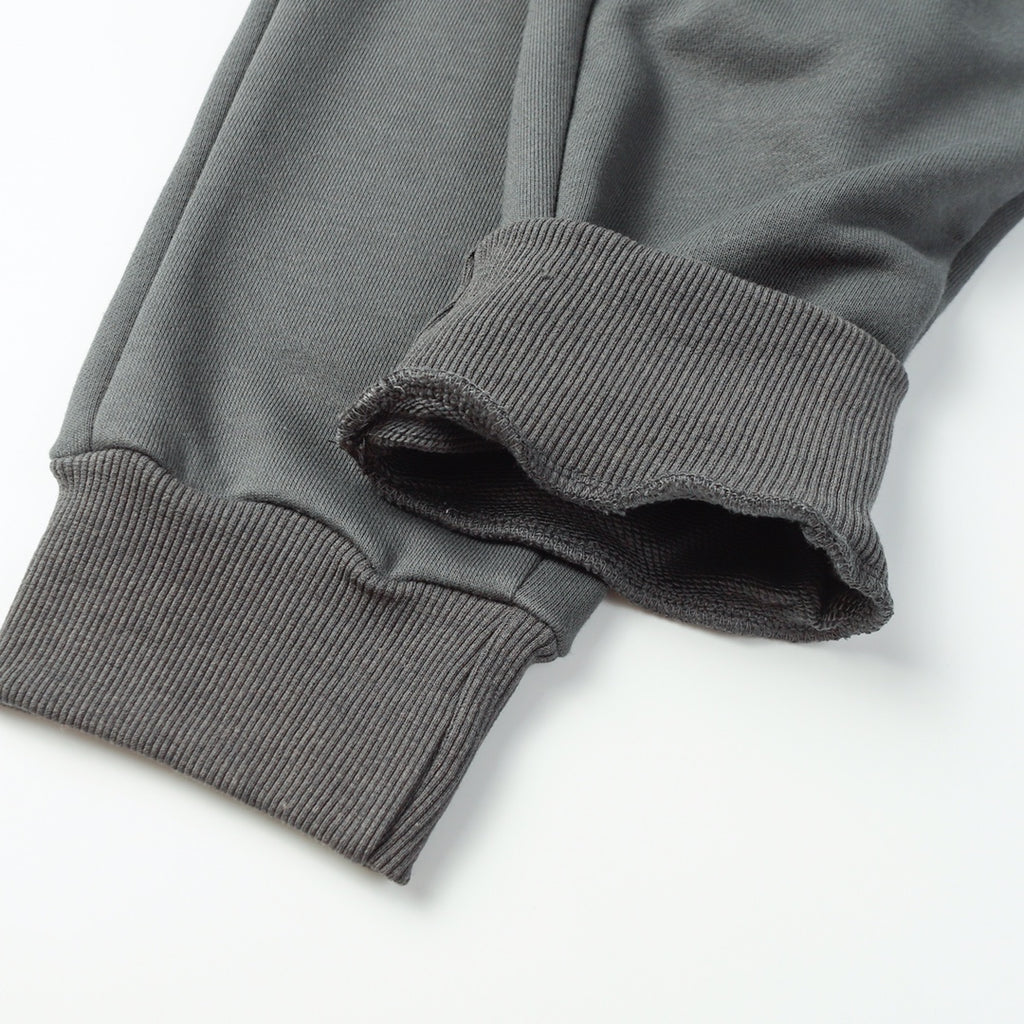 Stone Island pants with ribbed elastic cuffs and stitched hem, dark gray