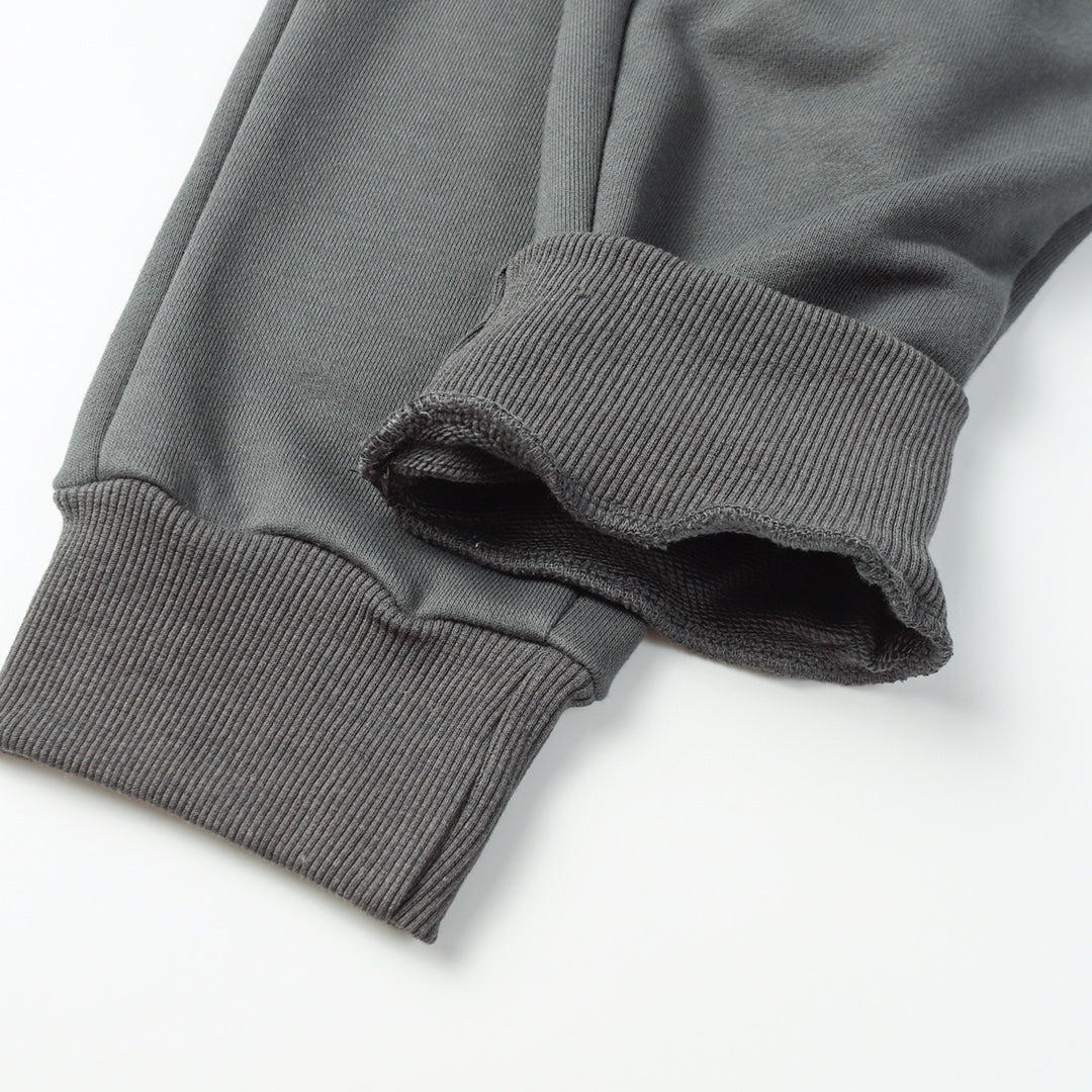 Stone Island pants with ribbed elastic cuffs and stitched hem, dark gray
