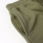 Olive joggers with elastic waistband and inner cuff stitching detail