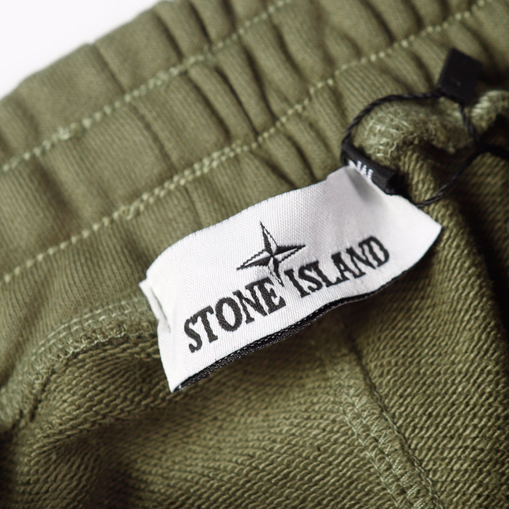 Olive joggers with Stone Island label on the drawcord area