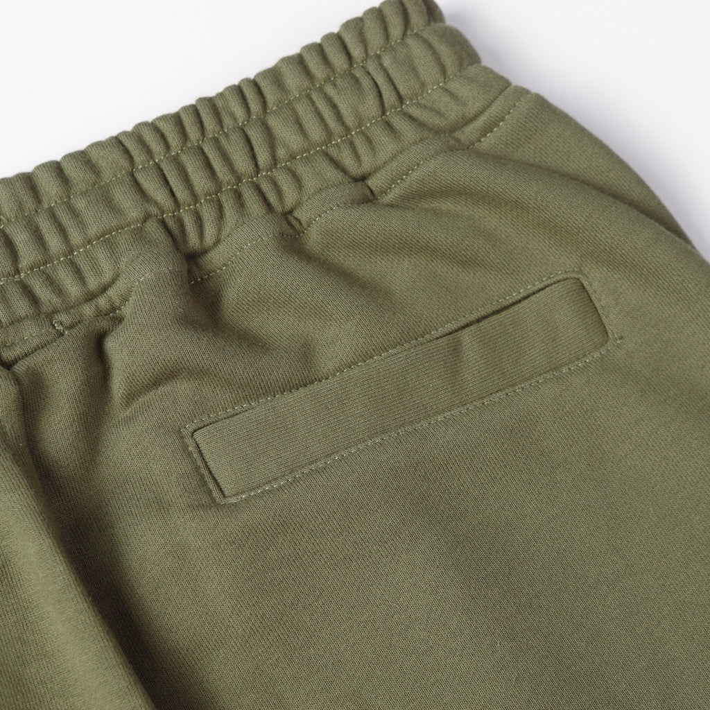 Olive joggers with front buttoned pocket and elastic waistband