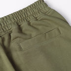Olive joggers with front buttoned pocket and elastic waistband