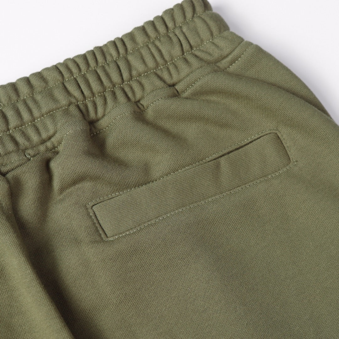 Olive joggers with front buttoned pocket and elastic waistband