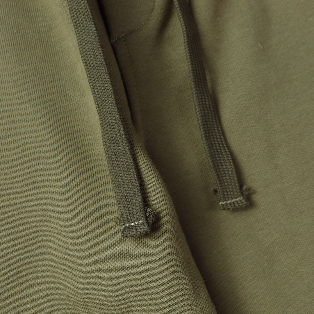 Stone Island olive hoodie drawstring ends and ribbed hood trim