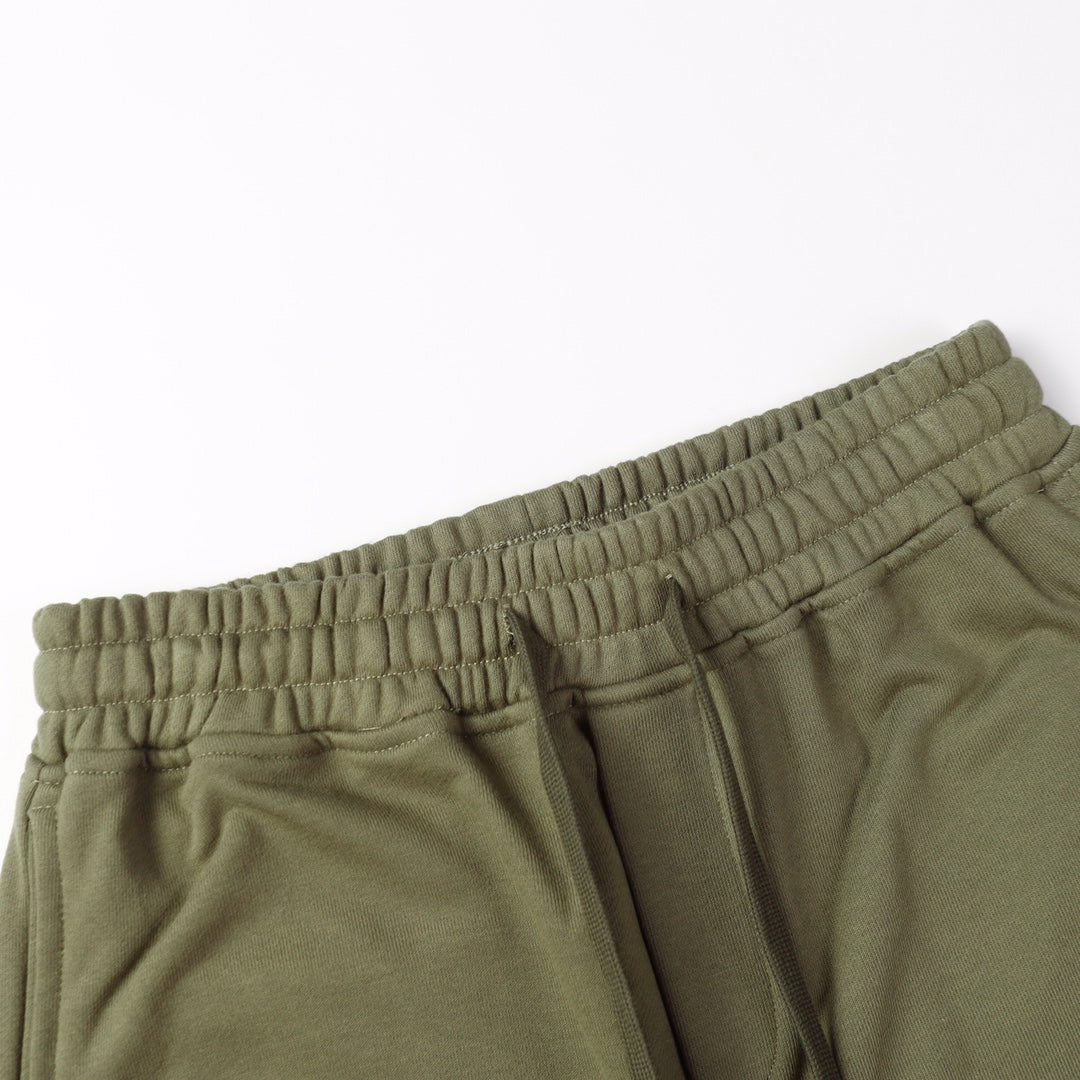 Olive joggers with elastic waistband and top view of drawcord opening