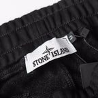Stone Island black jogger pants waistband with Stone Island interior label