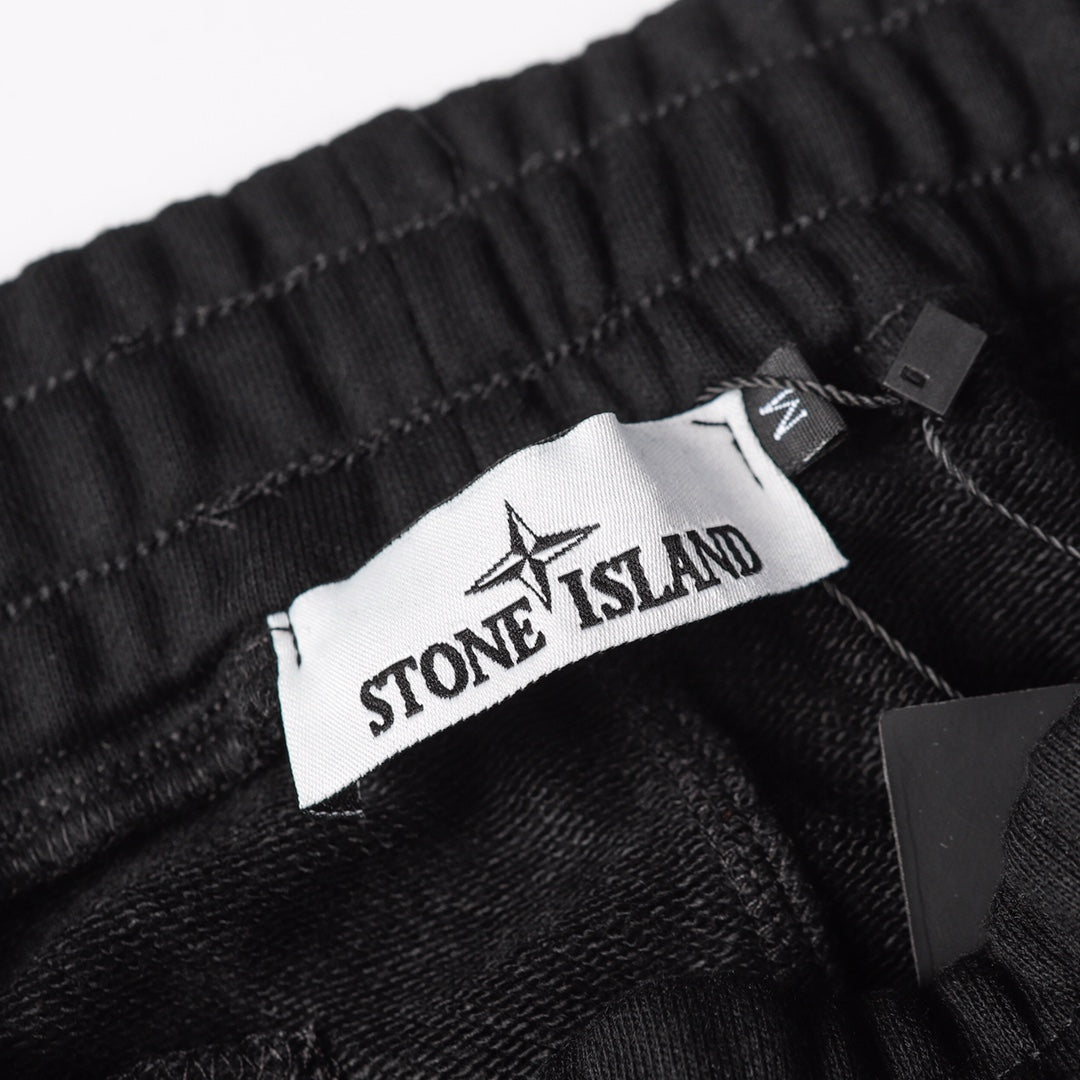 Stone Island black jogger pants waistband with Stone Island interior label