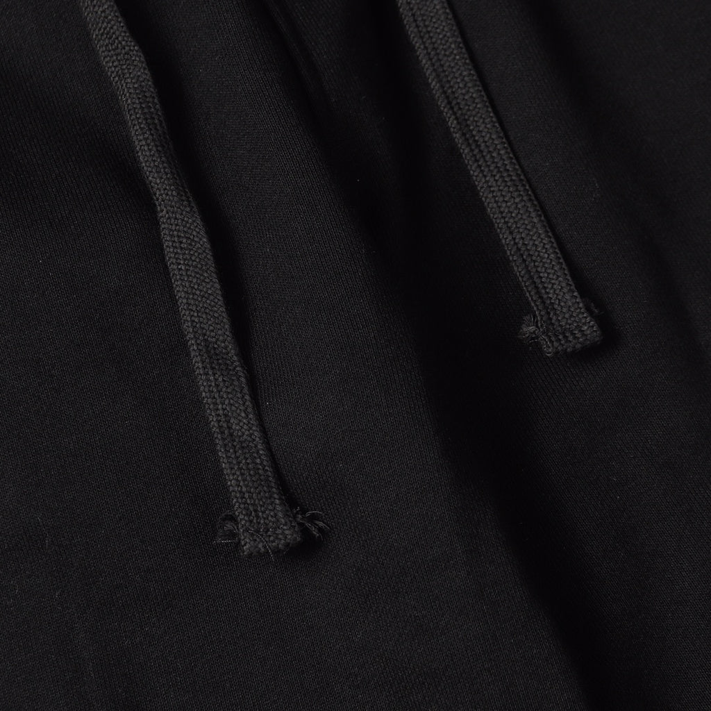 Stone Island black jogger pants close-up of drawcord and fabric texture