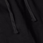 Stone Island black jogger pants close-up of drawcord and fabric texture