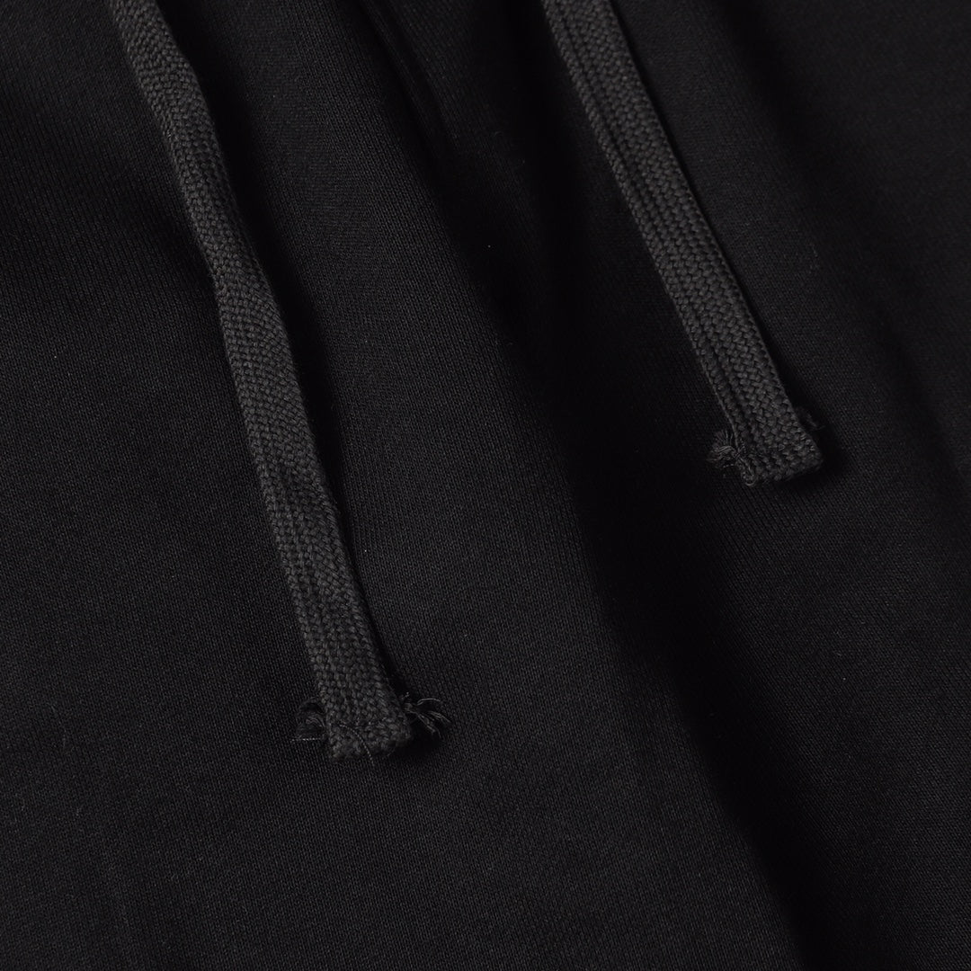 Stone Island black jogger pants close-up of drawcord and fabric texture