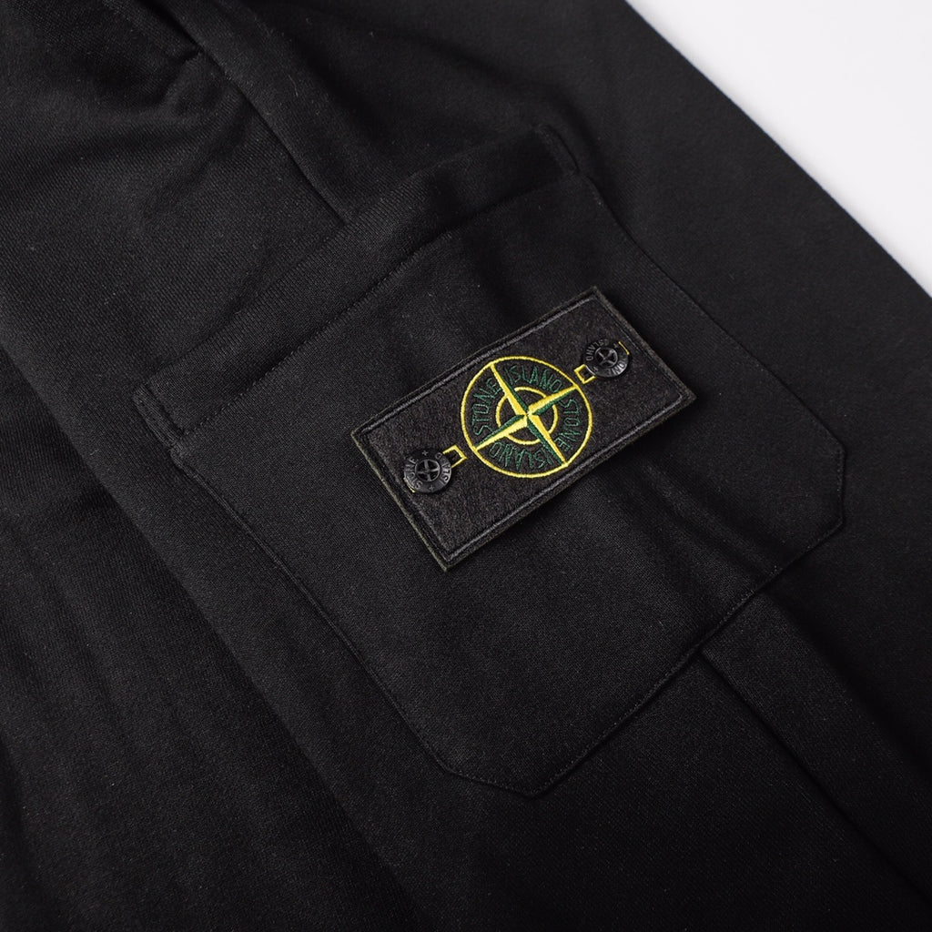 Stone Island logo patch on black jogger pants front pocket