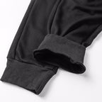 Stone Island trousers with ribbed cuffs and dark fabric hem