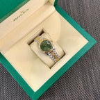 Rolex watch in box with two-tone bracelet and green dial, Roman numerals