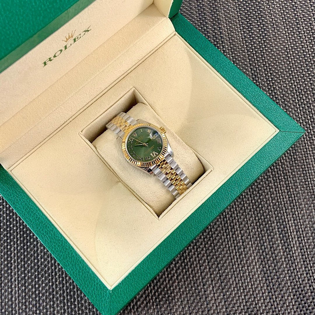 Rolex watch in box with two-tone bracelet and green dial, Roman numerals