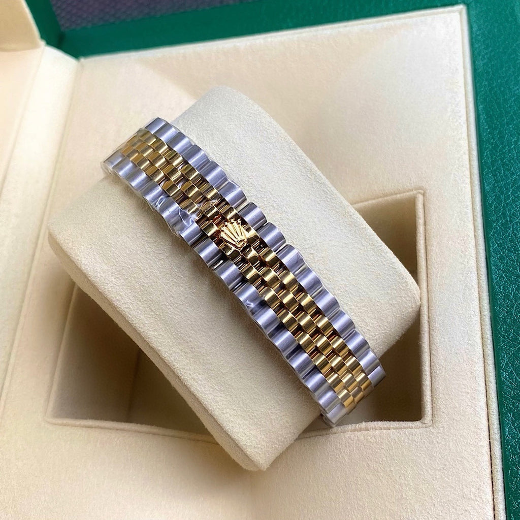 Rolex watch bracelet view with two-tone gold and silver links and clasp