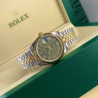 Rolex watch with two-tone bracelet and dark green dial, gold bezel, Roman numerals