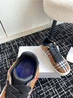 Burberry low-top sneakers, front view with blue-lined padded collar