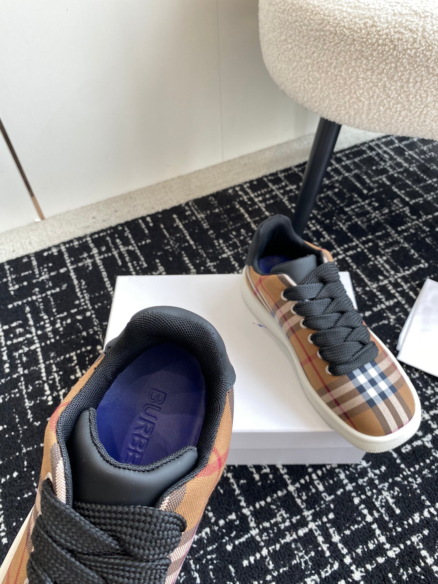Burberry low-top sneakers, front view with blue-lined padded collar