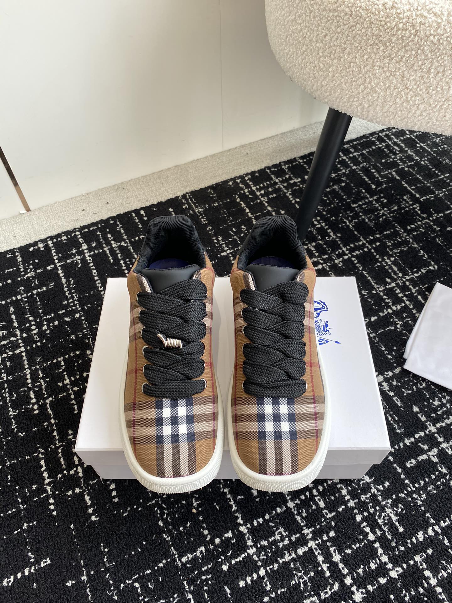 Burberry low-top sneakers, plaid uppers with black laces and white rubber sole