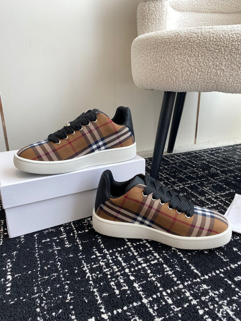 Burberry low-top sneakers, plaid canvas upper, black laces, and white platform sole