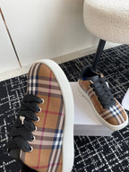 Burberry low-top sneakers, plaid side with black laces and blue-toned lining