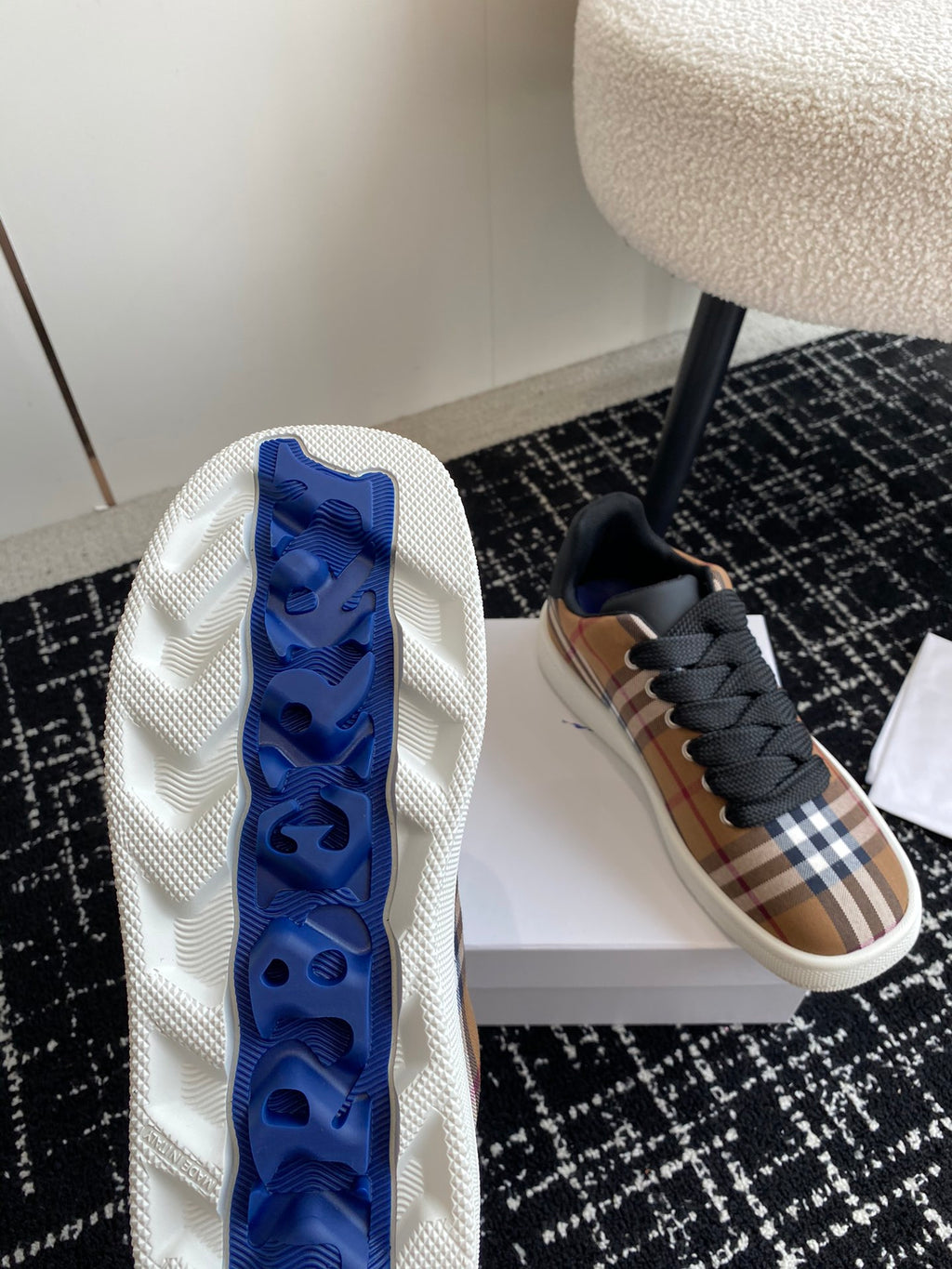 Burberry sneakers, white outsole with blue traction pattern on the underside