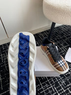 Burberry sneakers, white outsole with blue traction pattern on the underside