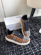 Burberry low-top sneakers, plaid toe cap with black laces on white soles