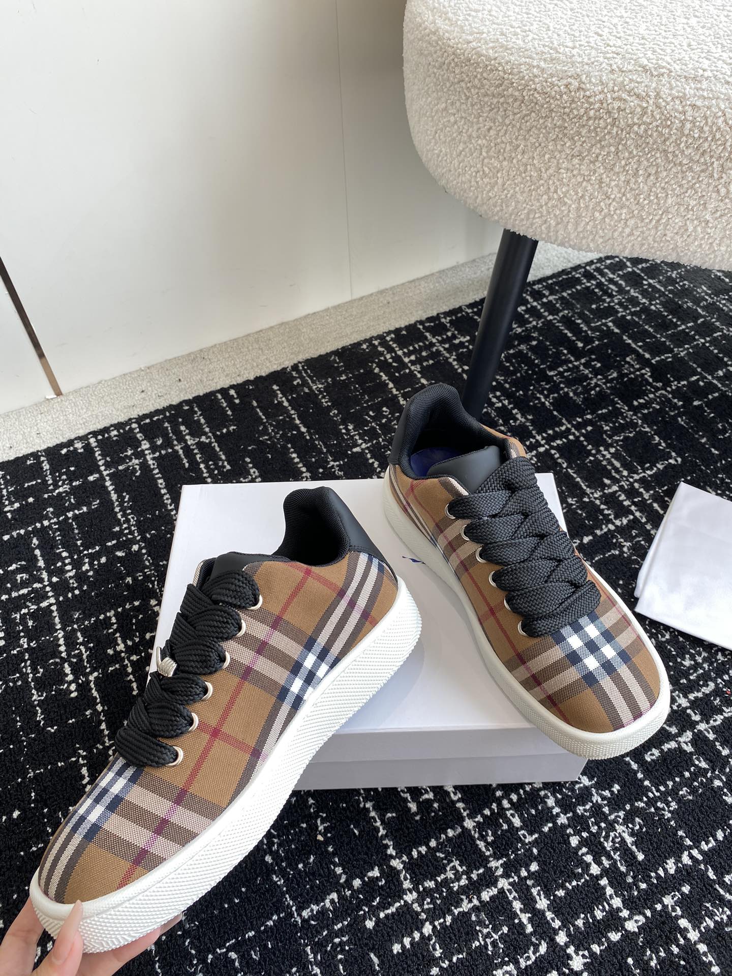 Burberry low-top sneakers, plaid upper with black laces and white rubber sole