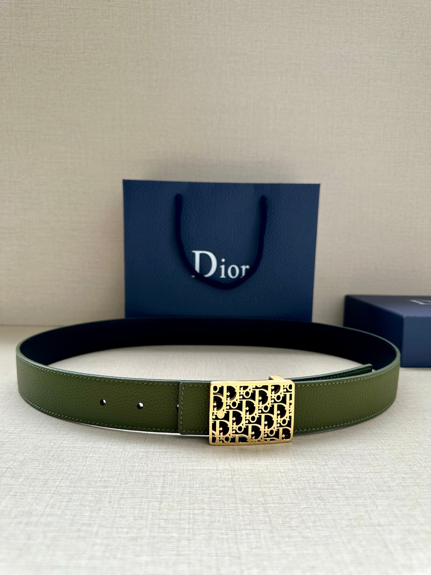 Dior belt in olive green leather with gold-tone Dior monogram buckle
