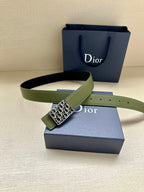 Dior belt laid out: olive green leather strap with gold-tone Dior monogram buckle