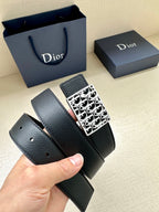 Dior leather belt with square monogram buckle; belt end with punched holes.