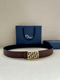 Reversible leather belt with gold Dior-pattern buckle and brown strap, with perforated holes.