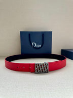 Dior belt in red with rectangular logo buckle, adjustable holes.