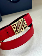 Dior belt close-up: red strap with gold-tone rectangular logo buckle.