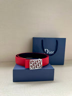Dior belt in red with silver-tone rectangular logo buckle and multiple holes.