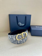 Dior belt with gold CD buckle on light-blue logo strap