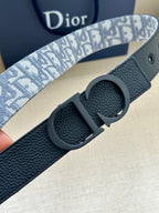 Leather Dior belt with blue patterned strap and round dark buckle detail