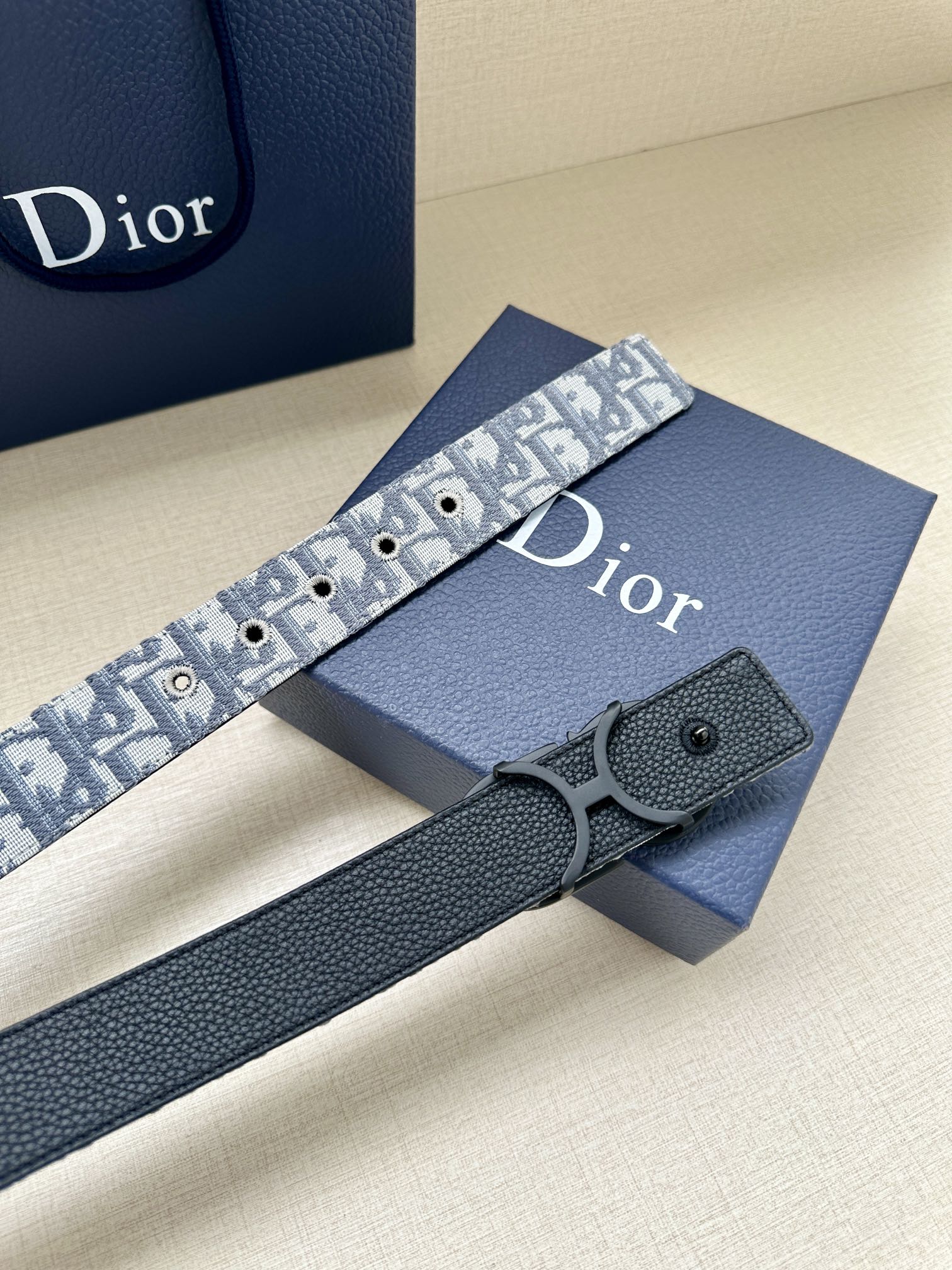 Dior belt with blue patterned strap and dark leather keeper, silver buckle
