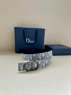 Dior monogram belt with light blue-gray canvas strap and silver buckle
