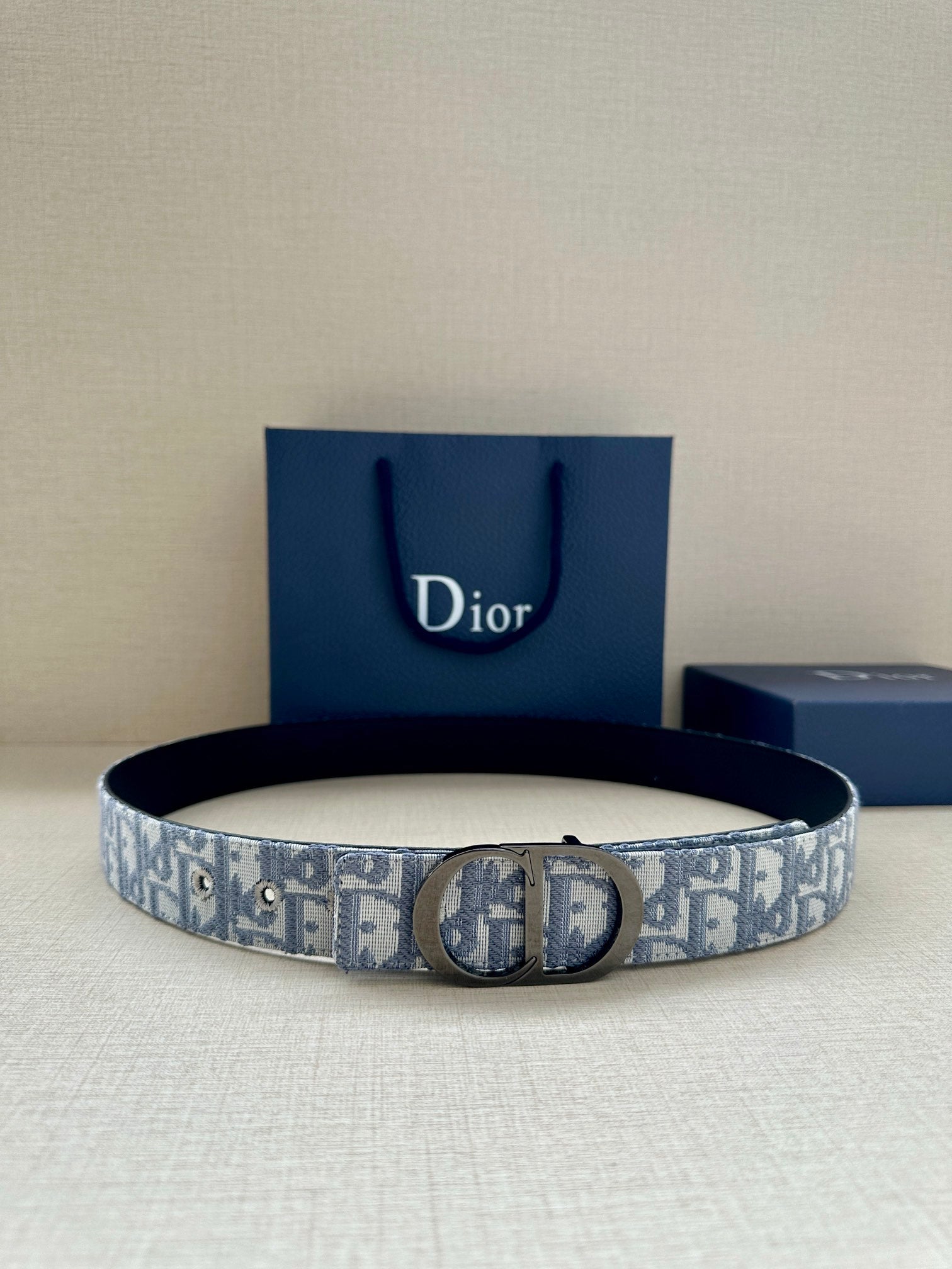 Dior belt with light blue-gray monogram canvas strap and silver-tone buckle