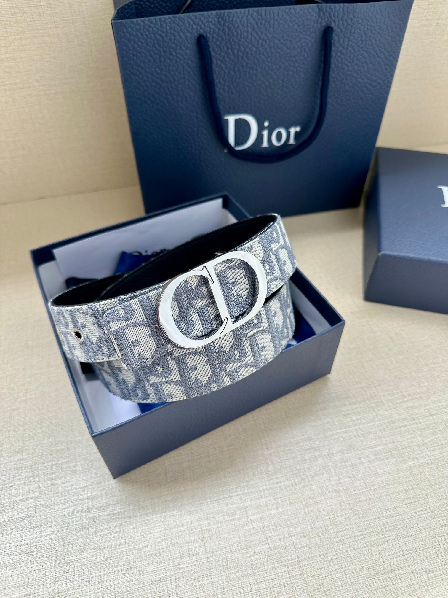 Dior belt in box: light blue-gray monogram canvas strap with silver buckle